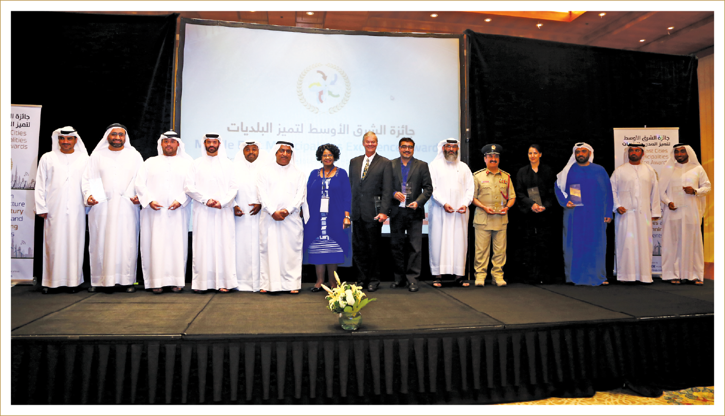 Award ceremony stage with dignitaries and honorees